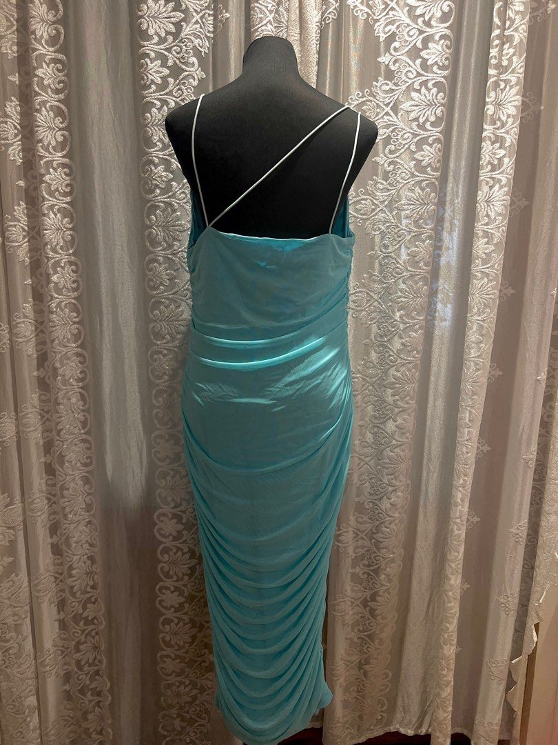 Aqua Blue Ruched Mesh Maxi Dress (Category: Evening dresses & gowns) located in Manila. Submitted by soukcasa (Listing ID 1409020418, Image 2). Description: Size👚: L Brand🛒: Marthea Conditon🛍️: Never worn RFS👜: Wrong fit for me This is a showstopper dress with its striking blue mesh maxi and heavy ruching and a beautiful cowl neck design! DM me for inquiry!.