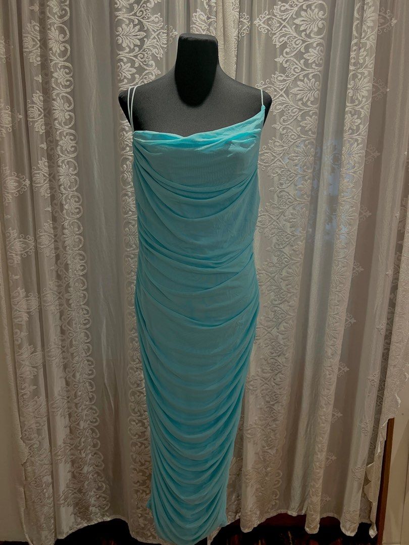 Aqua Blue Ruched Mesh Maxi Dress (Category: Evening dresses & gowns) located in Manila. Submitted by soukcasa (Listing ID 1409020418, Image 1). Description: Size👚: L Brand🛒: Marthea Conditon🛍️: Never worn RFS👜: Wrong fit for me This is a showstopper dress with its striking blue mesh maxi and heavy ruching and a beautiful cowl neck design! DM me for inquiry!.