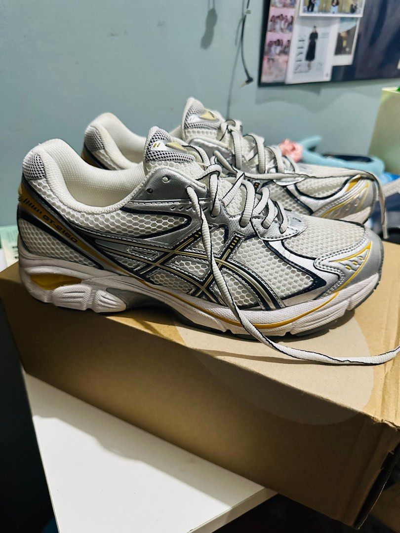Asics GT-2150 Running Shoes (Category: Sneakers) located in Paranaque City. Submitted by pumpkinhead25 (Listing ID 1409019994, Image 2). Description: - Asics GT-2160 running shoes - Color: White, silver, and yellow - Features the Asics logo - Mesh upper - Lace-up closure - Signs of wear on soles No issue Used once sa mall Still brandnew condition Free shipping Free shipping Free shipping.