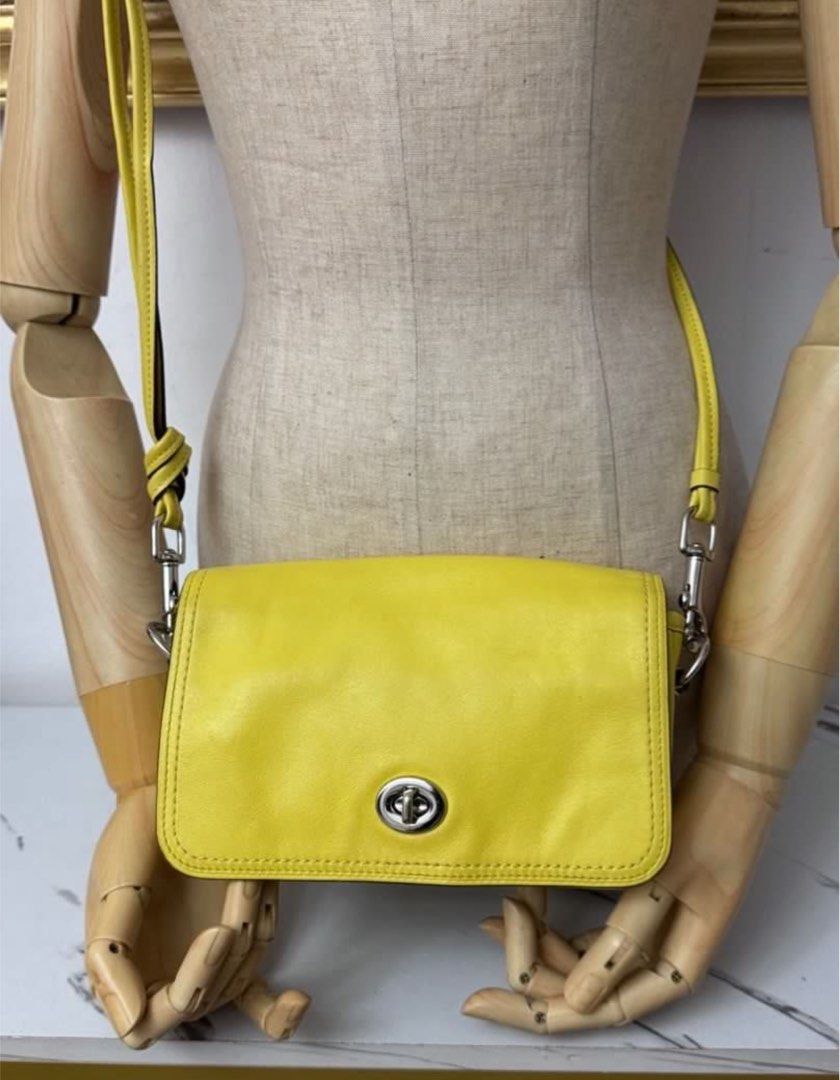 Authentic coach yellow penny sling bag (Category: Luxury Bags & Wallets) located in Rizal. Submitted by houseofbell (Listing ID 1404473786, Image 1). Description: Excellent condition Likenew Genuine leather material 💯 authentic .