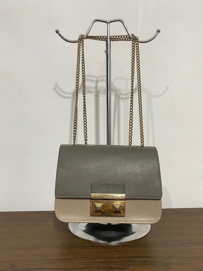 Authentic Furla Bella Mini Sling Bag (Category: Luxury Bags & Wallets) located in Bulacan. Submitted by knklittlecloset (Listing ID 1408888170, Image 1). Description: Authentic Furla Bella Mini sling bag Still in very good condition With signs of usage and faded hardwares Kindly check photos for details.
