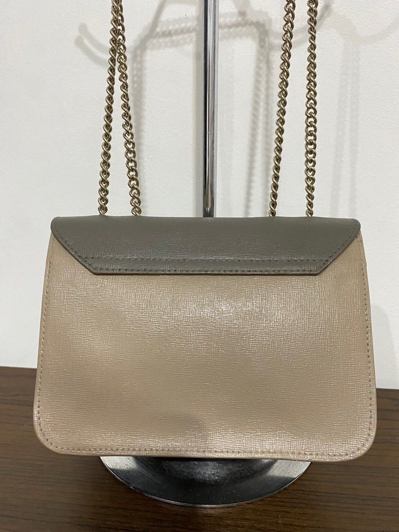 Authentic Furla Bella Mini Sling Bag (Category: Luxury Bags & Wallets) located in Bulacan. Submitted by knklittlecloset (Listing ID 1408888170, Image 2). Description: Authentic Furla Bella Mini sling bag Still in very good condition With signs of usage and faded hardwares Kindly check photos for details.
