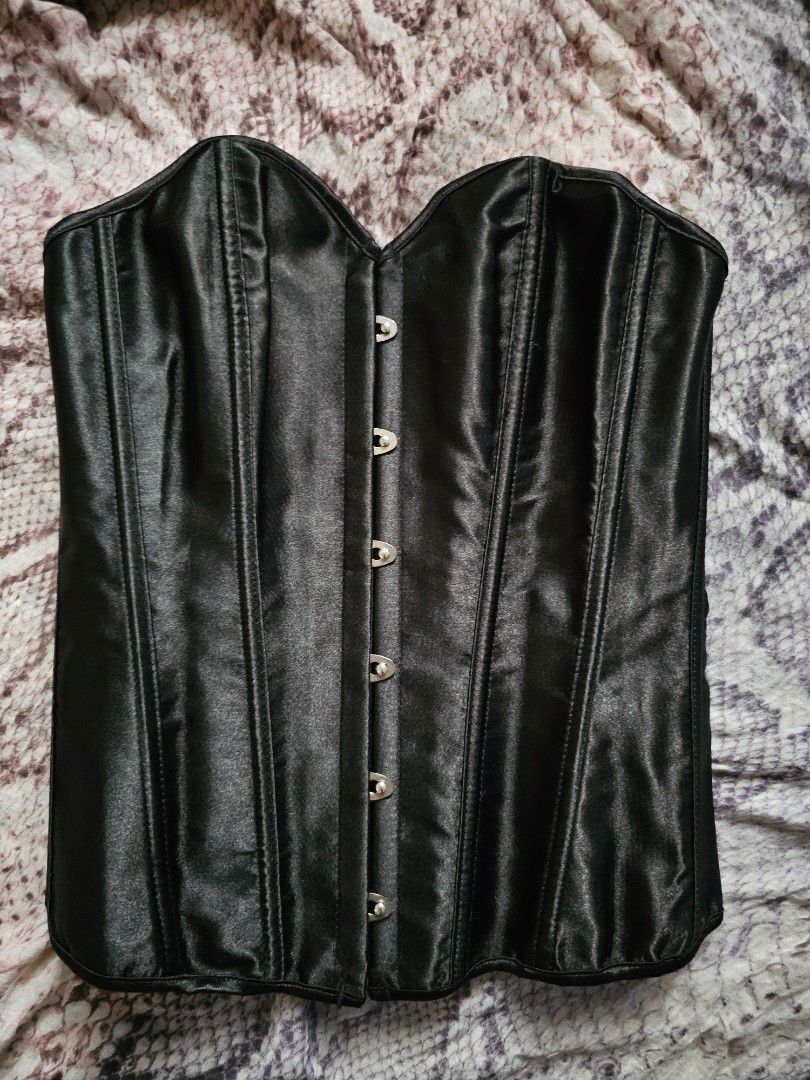 Black Corset with front closure (Category: Others Tops) located in Makati City. Submitted by randomelle (Listing ID 1405523497, Image 3). Description: PLEASE READ NEW, NEVER USED Last price already For sale only Available while posted RFS stored only, decluttering Black corset, fits up to M-size (up to bust 38, waist 28) Front closure with clasps Lace-up back for adjustable fit Structured, smooth, satin-like material Bought from orange app. Actua