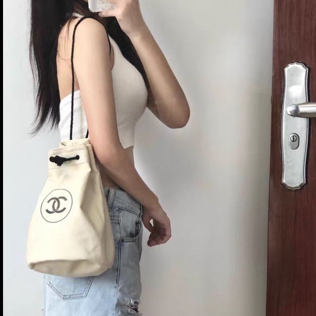 CHANEL NOVELTY DRAWSTRING BAG (Category: Luxury Bags & Wallets) located in Cavite. Submitted by second_story_ph (Listing ID 1409012020, Image 1). Description: CHANEL NOVELTY DRAWSTRING BAG STURDY POUCH OFFWHITE in great condition no issue good for daily use Authentic! DM📥.
