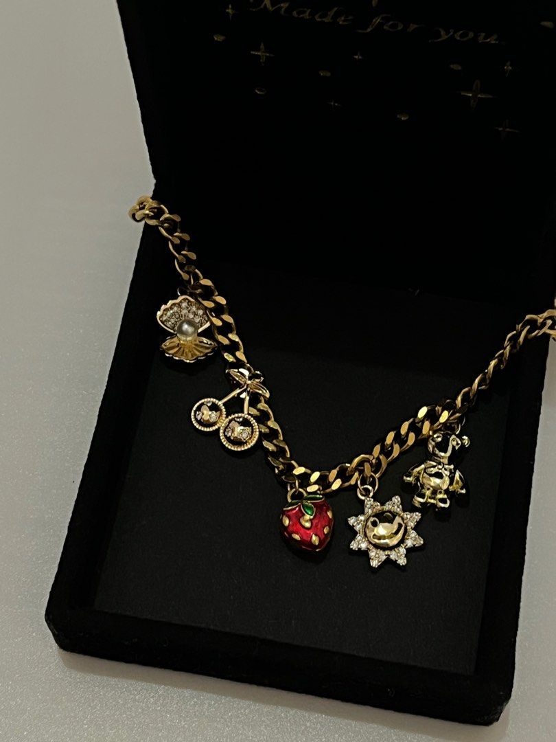 Charm Necklace Fashion (Category: Necklaces) located in Bacoor. Submitted by mayasells (Listing ID 1408924830, Image 1). Description: GARAGE SALE! - Good as new - 5 charms.
