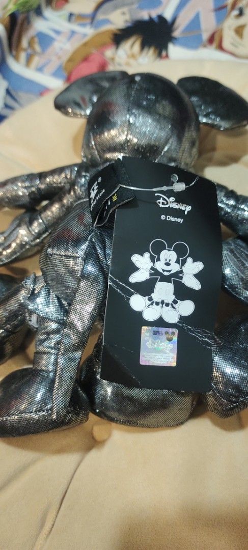 Disney Pop Infinity Snow Angel Mickey Plush (Category: Plushies & Soft Toys) located in San Mateo. Submitted by roxyj120919 (Listing ID 1408995192, Image 3). Description: - Pop Infinity Snow Angel Mickey plush toy - Features a metallic silver finish - Comes with original tags - Includes Disney and Mickey Mouse logos on the tag - Perfect for Disney collectors.