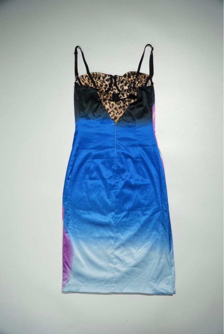 Dolce & Gabbana Printed Dress (Category: Dresses) located in Manila. Submitted by aevan143 (Listing ID 1408934910, Image 2). Description: - Dolce & Gabbana dress - Unique futuristic woman print - Leopard print bustier and straps - Made in Italy - Size 26/40 - Gradient blue and purple back - Zipper closure.