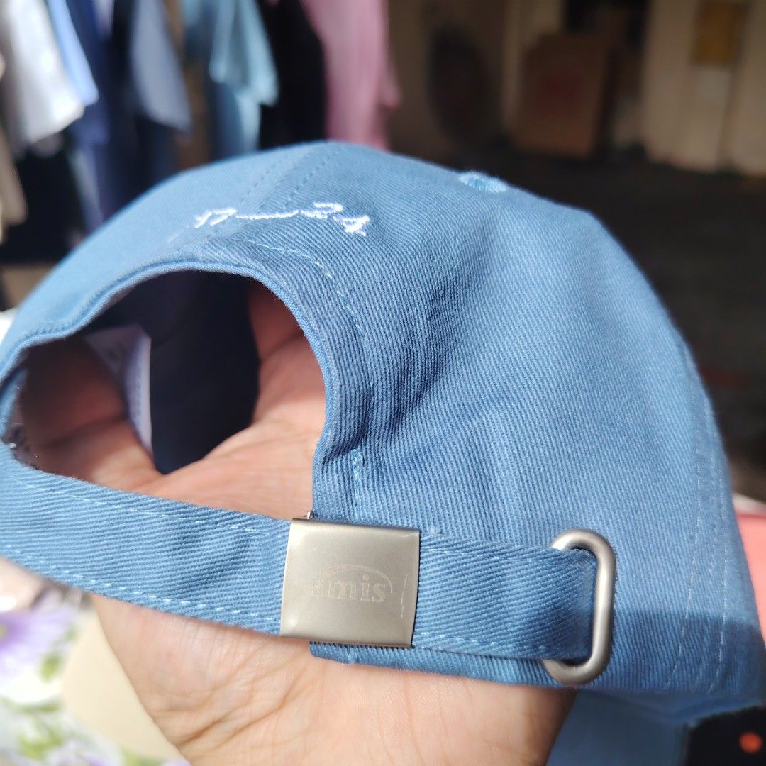 Emis Cap (Category: Caps & Hats) located in Quezon City. Submitted by rvco_stuff (Listing ID 1408922728, Image 3). Description: - Brand: Emis - Color: Light Blue - Logo: Red 'e' - Back Detail: 'E17 24' print - Closure: Adjustable metal clasp with 'emis' logo.