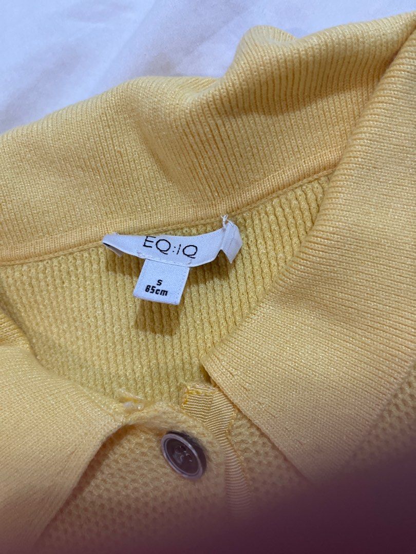 EQ:IQ Yellow Polo Shirt (Category: Shirts) located in Quezon City. Submitted by metric18 (Listing ID 1408894878, Image 2). Description: - EQ:IQ yellow polo shirt - Size: S - Features a collared neckline - Short sleeves - Three-button front - Material: Knitted - Bright yellow color - Ideal for casual outfits.