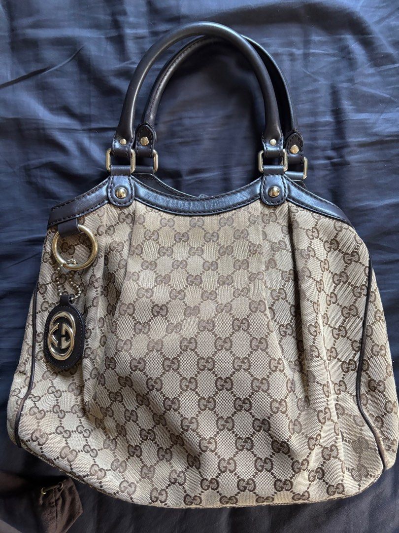 Gucci Sukey Tote (Medium) (Category: Luxury Bags & Wallets) located in Los Banos. Submitted by declutterlistt (Listing ID 1408898652, Image 1). Description: Selling my mom’s old bag. - Authentic - GG canvas - Leather handles and trim - Interior pocket - Includes dust bag and Gucci charm - Original receipt included Seller is based in Laguna and meetups will be in January 2 to 3 in MOA. .