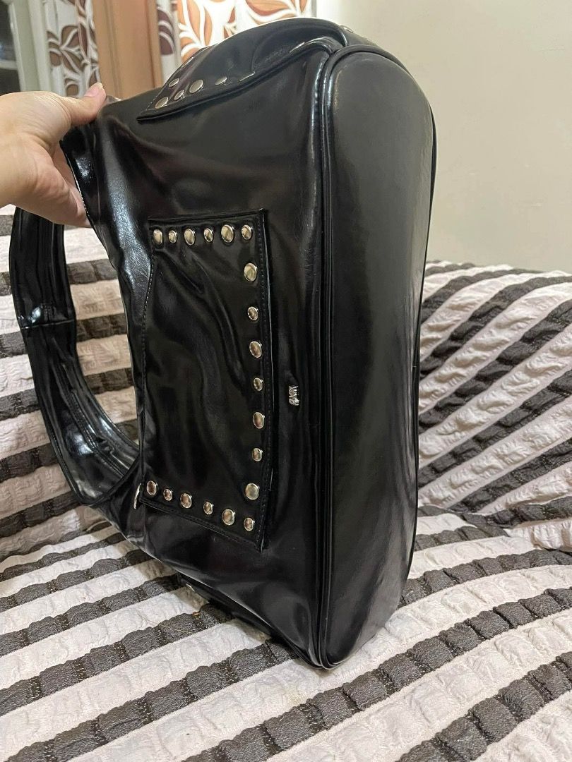 GVN Black Hobo Bag with Studs (Category: Luxury Bags & Wallets) located in Tarlac. Submitted by elle.xoxo_ (Listing ID 1409034177, Image 3). Description: 📍Open for Swapping -Swap for chestnut color studded bag. one of my favss Black hobo bag with a single shoulder strap. Features silver-tone stud details and a magnetic snap closure. Includes a small pocket on the side. The bag has a spacious interior and a sleek design. .