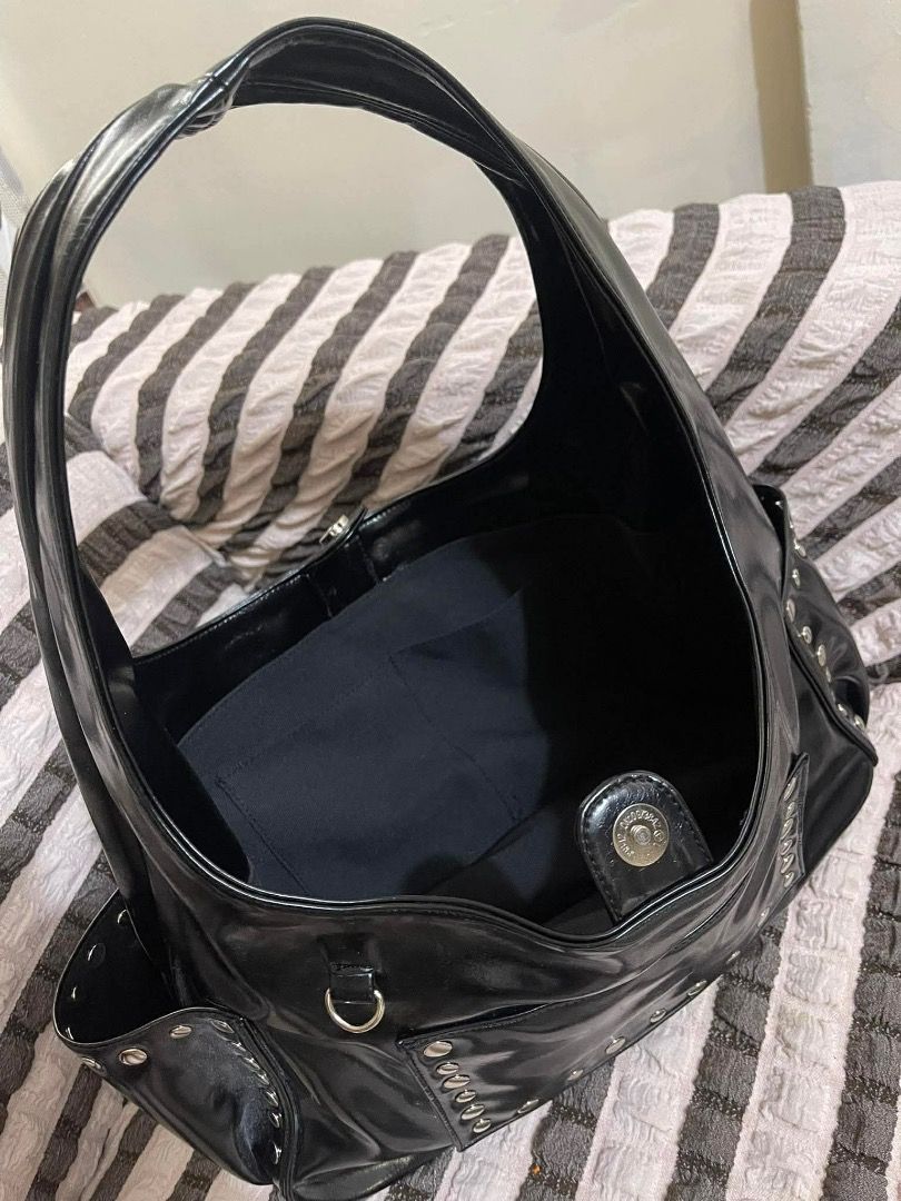 GVN Black Hobo Bag with Studs (Category: Luxury Bags & Wallets) located in Tarlac. Submitted by elle.xoxo_ (Listing ID 1409034177, Image 2). Description: 📍Open for Swapping -Swap for chestnut color studded bag. one of my favss Black hobo bag with a single shoulder strap. Features silver-tone stud details and a magnetic snap closure. Includes a small pocket on the side. The bag has a spacious interior and a sleek design. .