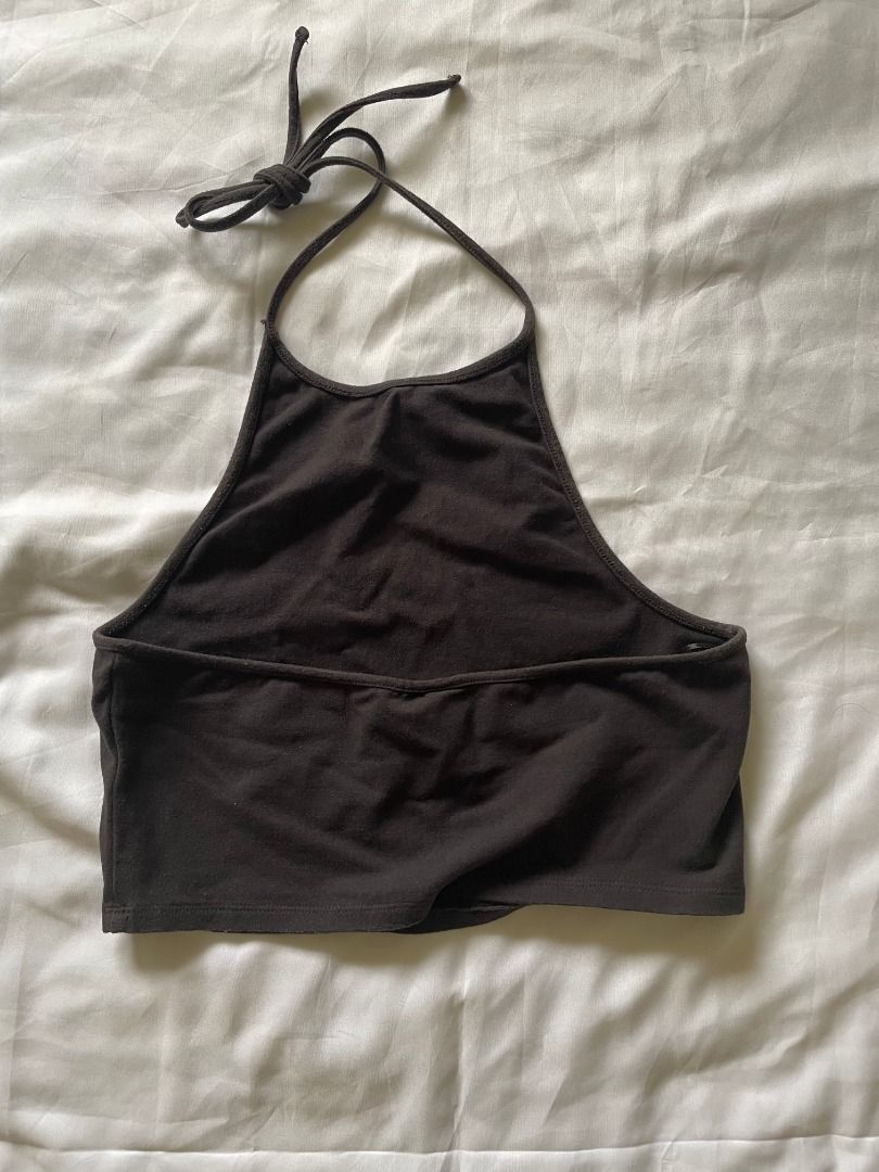 H&M Black Halter Crop Top (Category: Others Tops) located in Paranaque City. Submitted by tortoisee (Listing ID 1409037616, Image 2). Description: condition: used a couple of times, prints faded. no damage or stains - fits xs-s - tie-up halter neck - cropped length - small graphic print - rfs: decluttering.