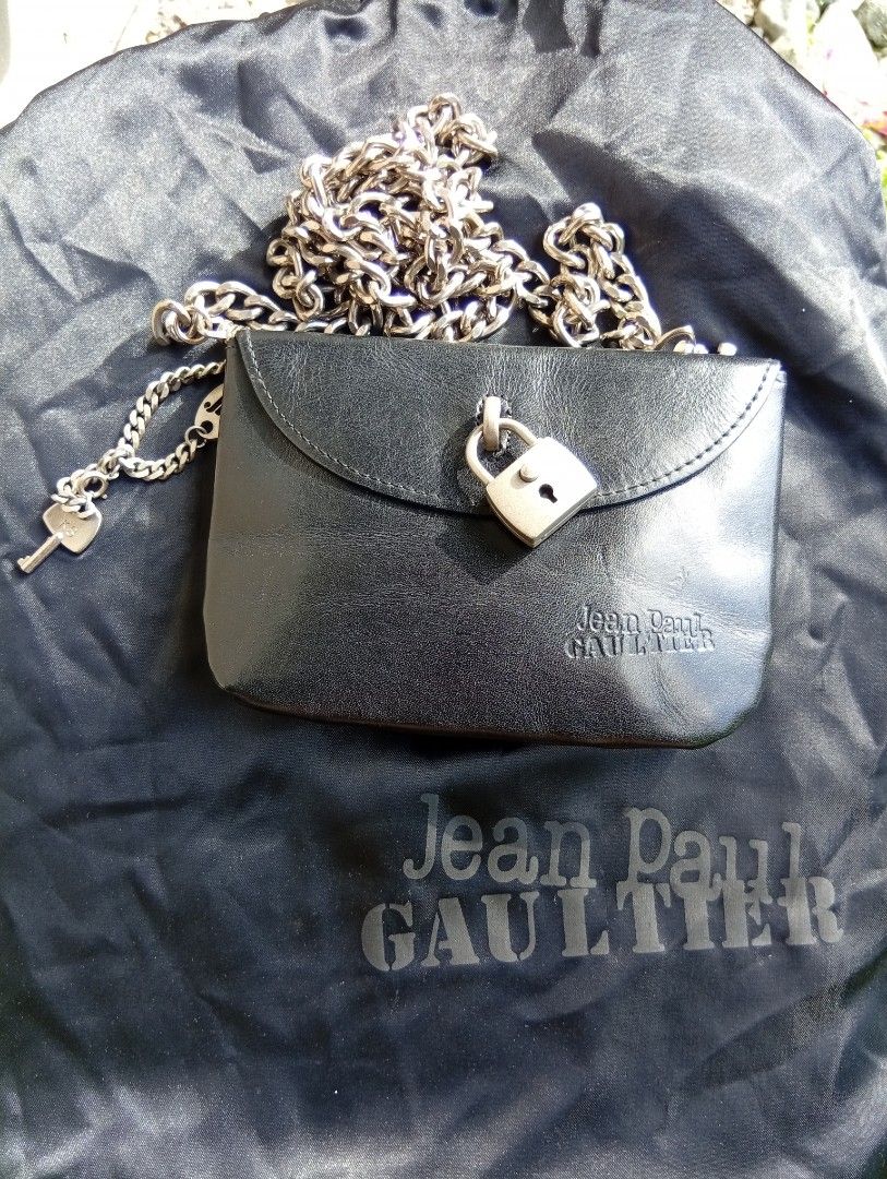 Jean Paul Gaultier Black Chain Bag (Category: Luxury Bags & Wallets) located in Cabadbaran. Submitted by lagiuminomtubig1 (Listing ID 1408892899, Image 1). Description: - Authentic Jean Paul Gaultier bag - Black color - Chain strap (silver-toned) - Lock closure with key charm - Jean Paul Gaultier logo embossed - Includes dust bag - Small size, ideal for essentials.