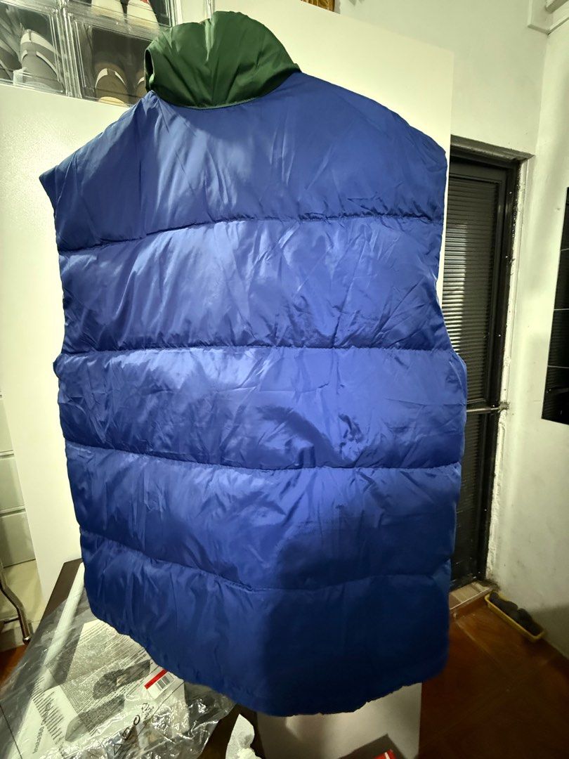 Levi's Colorblock Puffer Vest (Category: Vests) located in Manila. Submitted by blank_espacio (Listing ID 1408988913, Image 2). Description: - Levi's puffer vest - Unique colorblock design: blue, green, and maroon panels - Two front pockets with yellow lining - Zip-up closure - Solid blue back - Collar - Levi's logo patch.