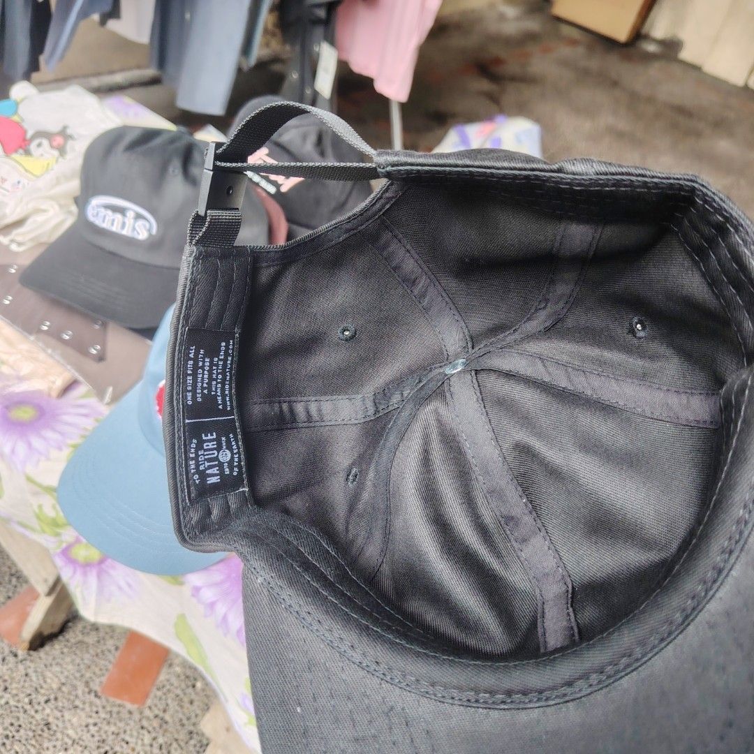 Nature Black Cap (Category: Caps & Hats) located in Quezon City. Submitted by rvco_stuff (Listing ID 1408923248, Image 3). Description: - Black cap with a stylish globe logo. - Features an adjustable strap for a comfortable fit. - Made from durable fabric, built to last. - Brand tag: Nature. - Ideal for daily use..