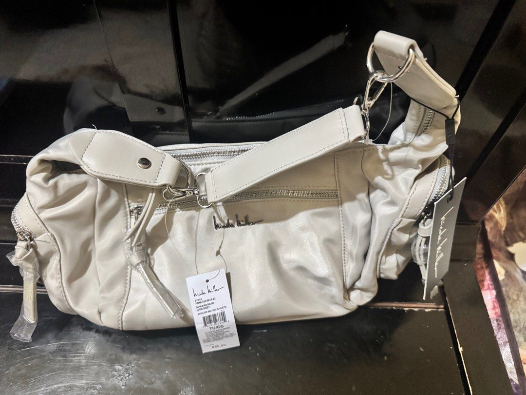 Nicole Miller Shoulder Bag (Category: Shoulder Bags) located in San Pedro. Submitted by jaazi (Listing ID 1408991019, Image 2). Description: - Nicole Miller Shoulder Bag - Stylish design - Neutral color - With tags - Perfect for everyday use.