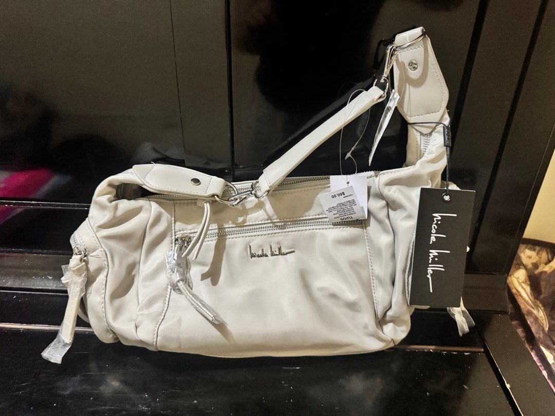 Nicole Miller Shoulder Bag (Category: Shoulder Bags) located in San Pedro. Submitted by jaazi (Listing ID 1408991019, Image 3). Description: - Nicole Miller Shoulder Bag - Stylish design - Neutral color - With tags - Perfect for everyday use.