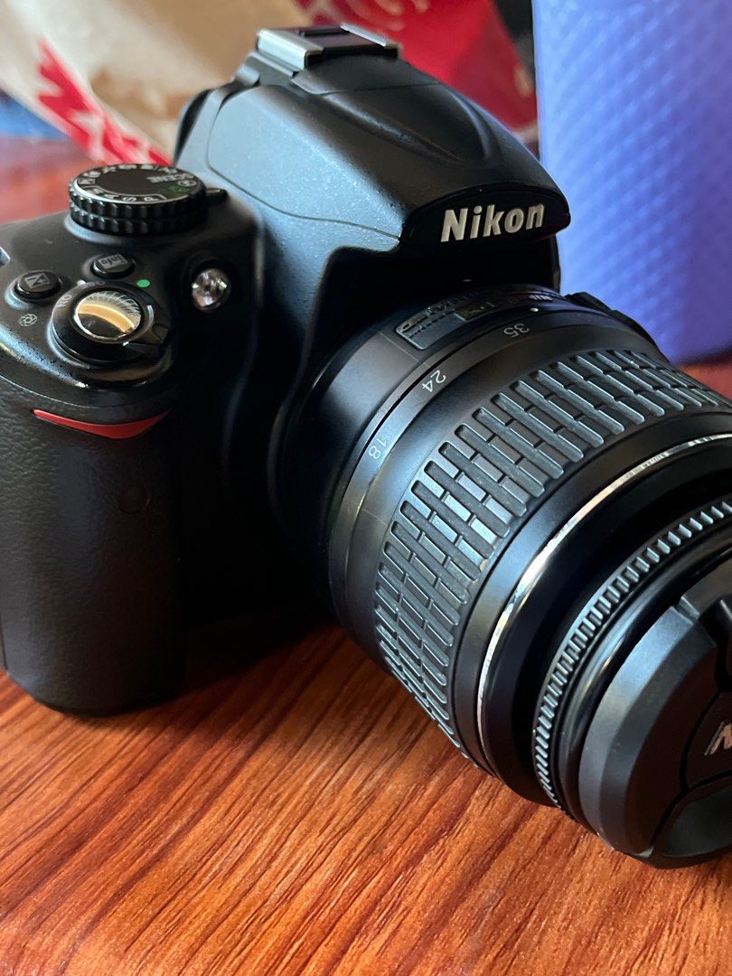 Nikon DSLR Camera with Lens (Category: Cameras) located in Bongabong. Submitted by theamariano (Listing ID 1408956219, Image 2). Description: - Nikon DSLR camera - Includes 18-35mm lens - Built-in flash - Flip-out screen - Black camera body.