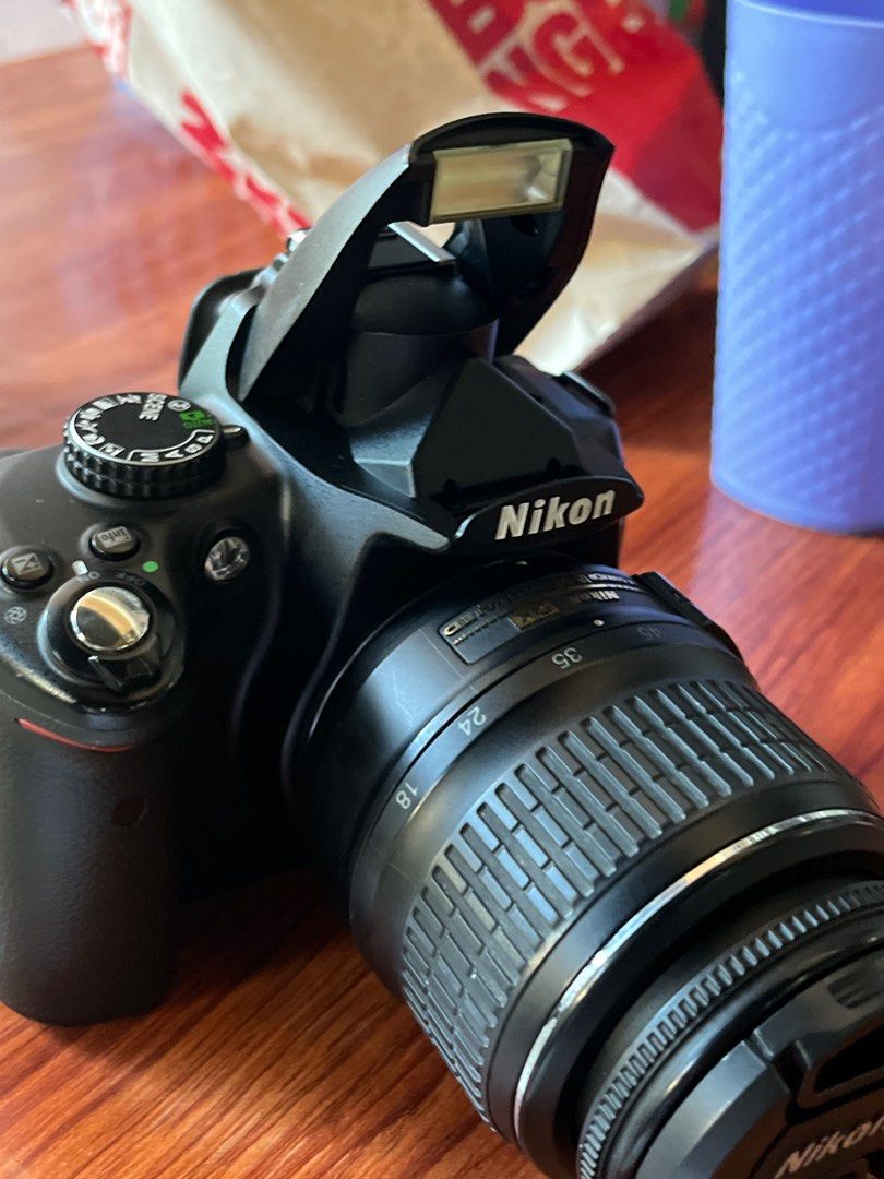 Nikon DSLR Camera with Lens (Category: Cameras) located in Bongabong. Submitted by theamariano (Listing ID 1408956219, Image 3). Description: - Nikon DSLR camera - Includes 18-35mm lens - Built-in flash - Flip-out screen - Black camera body.