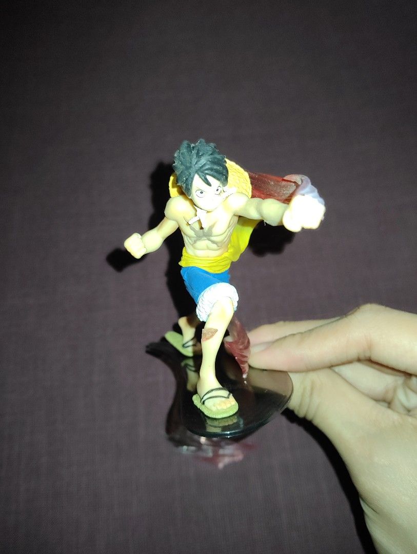 One Piece Monkey D. Luffy Figurine 1 (Category: Figurines & Statues) located in Pasig City. Submitted by hazelscollectibles (Listing ID 1409051525, Image 2). Description: - One Piece Luffy figurine - Features Luffy in a dynamic pose natnagal Yung Isang part can be glued - Includes his iconic straw hat and shorts - Comes with a clear stand - Includes additional effect parts - Perfect for One Piece fans and collectors.