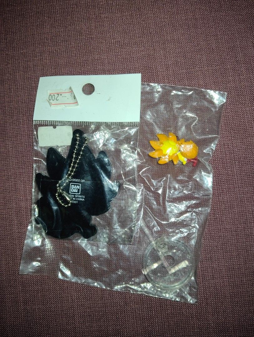 One Piece Thousand Sunny Keychain and Figure set (Category: Character Goods) located in Pasig City. Submitted by hazelscollectibles (Listing ID 1408977339, Image 2). Description: - Two One Piece Thousand Sunny items for sale! - Item 1: Keychain - Item 2: Small figure with stand - Both items are brand new and still in their original packaging. - Keychain features a black backing with the Bandai logo..