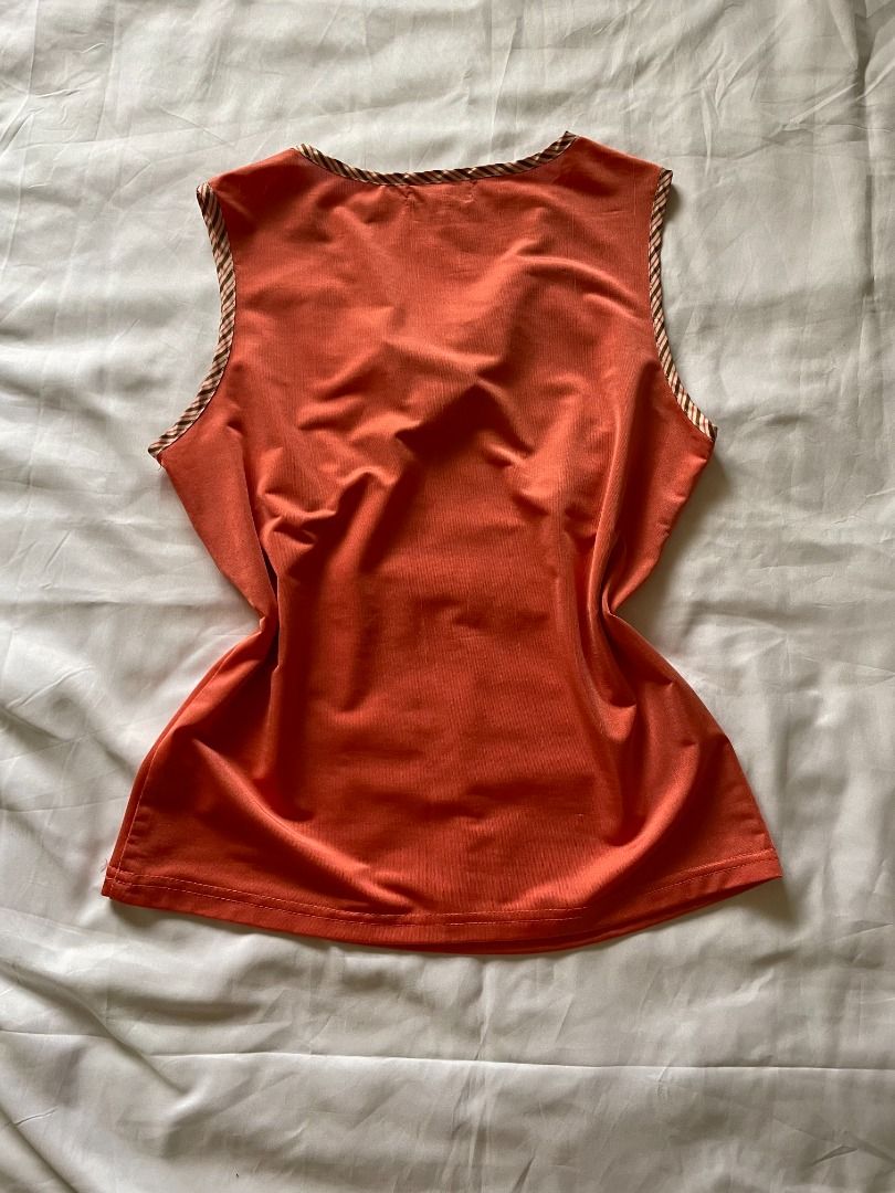 Orange Tank Top with Striped Trim (Category: Sleeveless) located in Paranaque City. Submitted by tortoisee (Listing ID 1409051833, Image 2). Description: condition: used once or twice, no damages or stain - fits s-m - ribbed tank top - striped trim on neckline and armholes - lightweight fabric - rfs: decluttering.