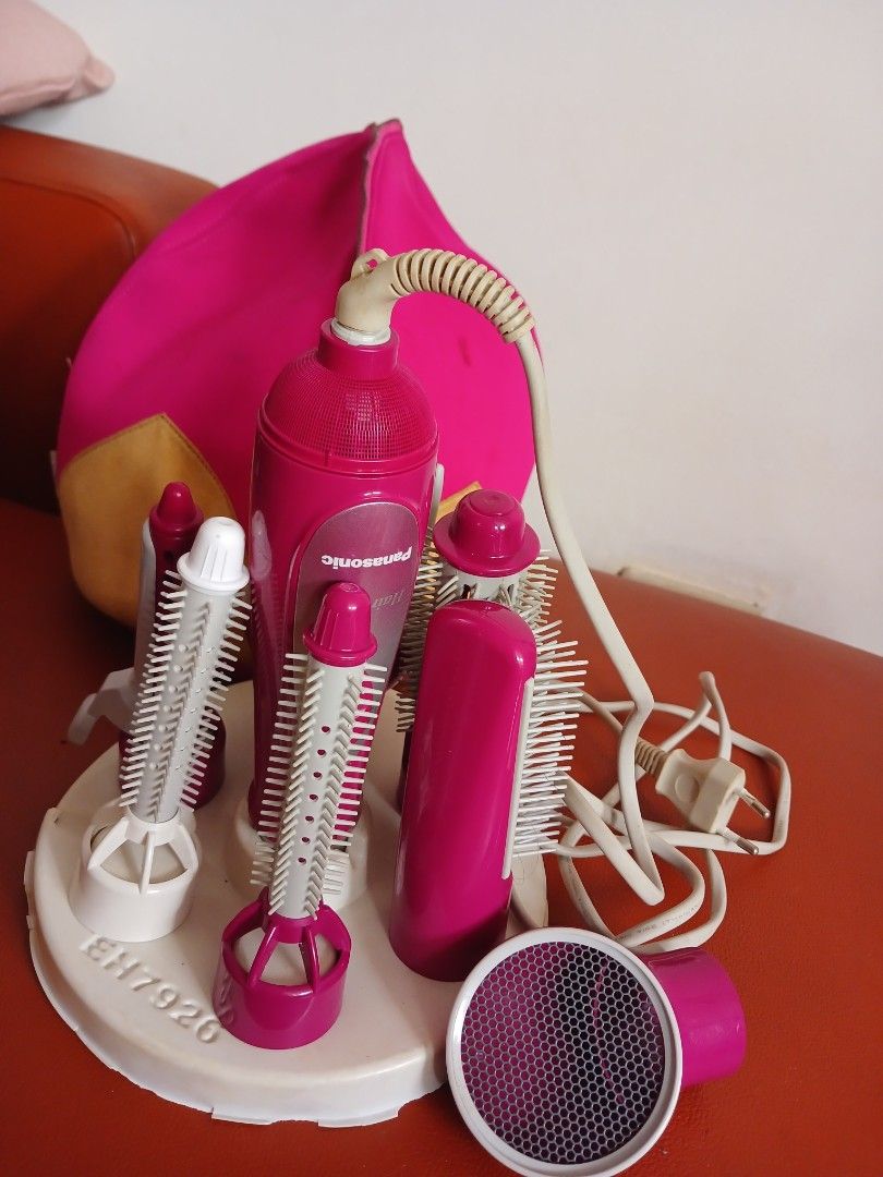 Panasonic Hair Styler EH7920 (Category: Hair) located in Marikina City. Submitted by laila15 (Listing ID 1408903757, Image 1). Description: - Panasonic EH7920 hair styler - Includes various brush heads and a diffuser - Stylish pink and white design - Comes with a power cord - Not used got stock only - Good working condition.