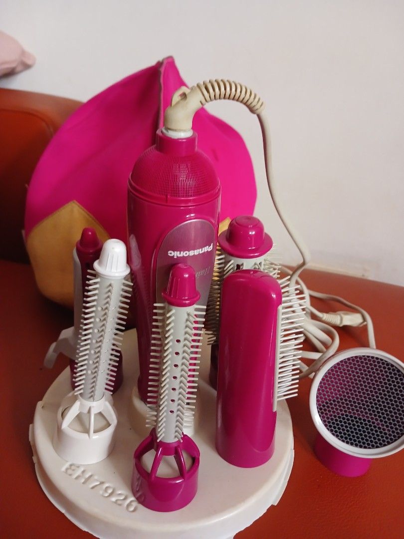 Panasonic Hair Styler EH7920 (Category: Hair) located in Marikina City. Submitted by laila15 (Listing ID 1408903757, Image 3). Description: - Panasonic EH7920 hair styler - Includes various brush heads and a diffuser - Stylish pink and white design - Comes with a power cord - Not used got stock only - Good working condition.