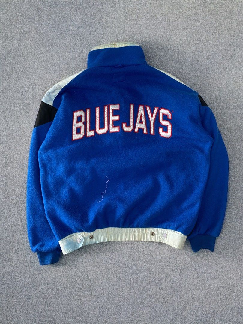 Vintage Chalk Line Blue Jays Jacket (Category: Coats, Jackets and Outerwear) located in General Trias. Submitted by mangu_ukay (Listing ID 1408893851, Image 2). Description: - Vintage Chalk Line Blue Jays jacket - Blue fleece body with black and white accents - Full zip closure - High collar - "BLUE JAYS" lettering on the back - Made in Korea - Size M/M.