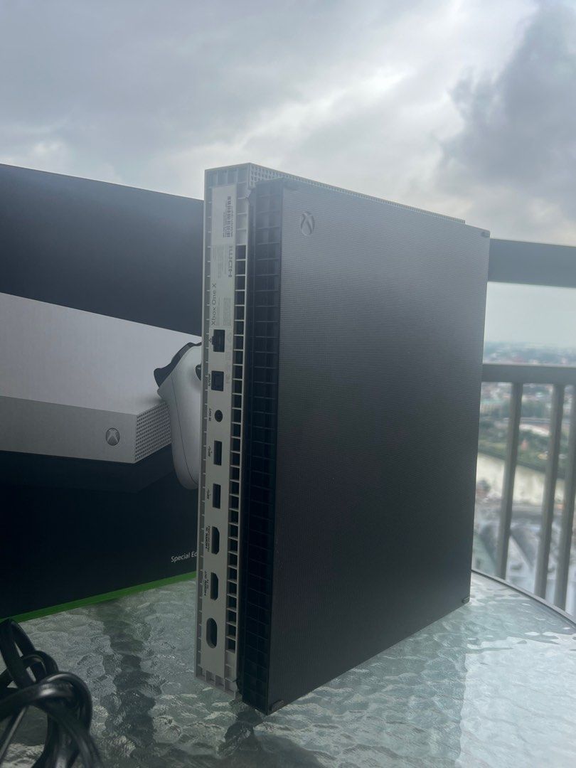 Xbox One X (Bought in US) (Category: Xbox) located in Manila. Submitted by aprilis25 (Listing ID 1408939514, Image 2). Description: Microsoft Xbox One X white special edition 1 tb console complete in box with OEM green controller, power cord, HDMI, packaging, and papers. Tested and working, very good condition. Pick up/Meet up @sheridan towers Only .
