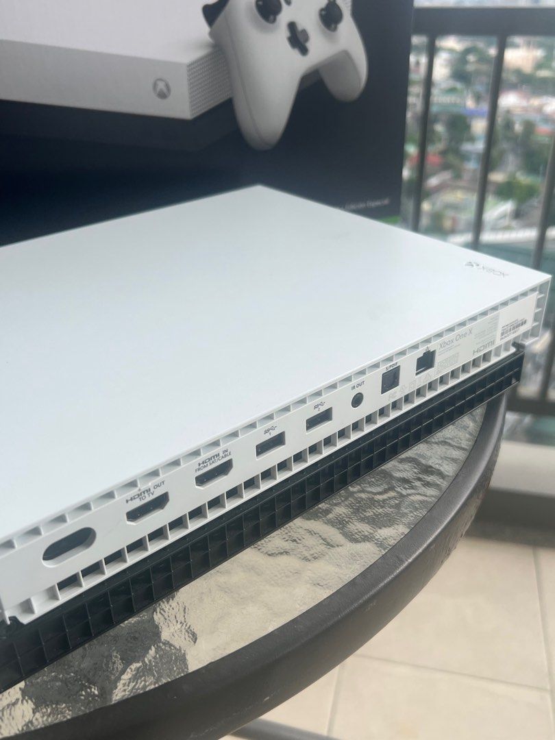 Xbox One X (Bought in US) (Category: Xbox) located in Manila. Submitted by aprilis25 (Listing ID 1408939514, Image 3). Description: Microsoft Xbox One X white special edition 1 tb console complete in box with OEM green controller, power cord, HDMI, packaging, and papers. Tested and working, very good condition. Pick up/Meet up @sheridan towers Only .
