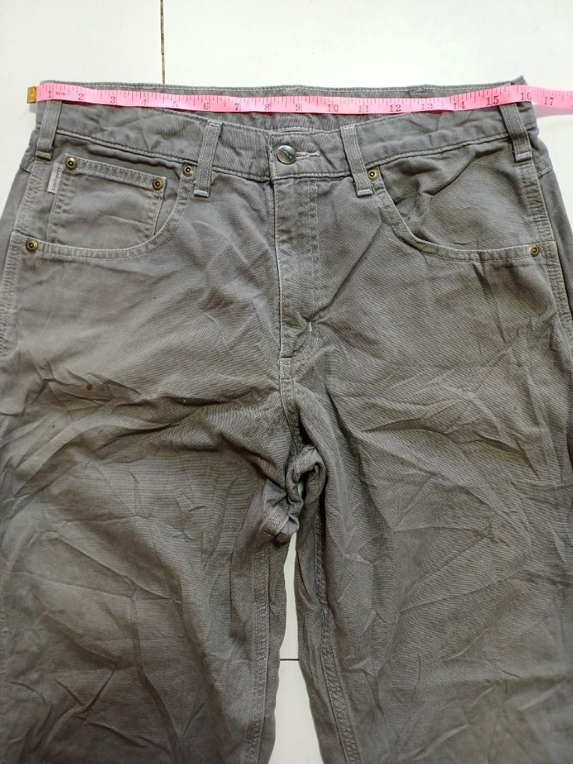 Carhartt Gray Carpenter Pants (Category: Jeans) located in Pasig City. Submitted by Magdythrift23 (Listing ID 1409076504, Image 3). Description: - Gray Carhartt carpenter pants - Carhartt logo on front pocket and back patch - Button and zipper closure - Made from durable fabric - Suitable for work or casual wear.