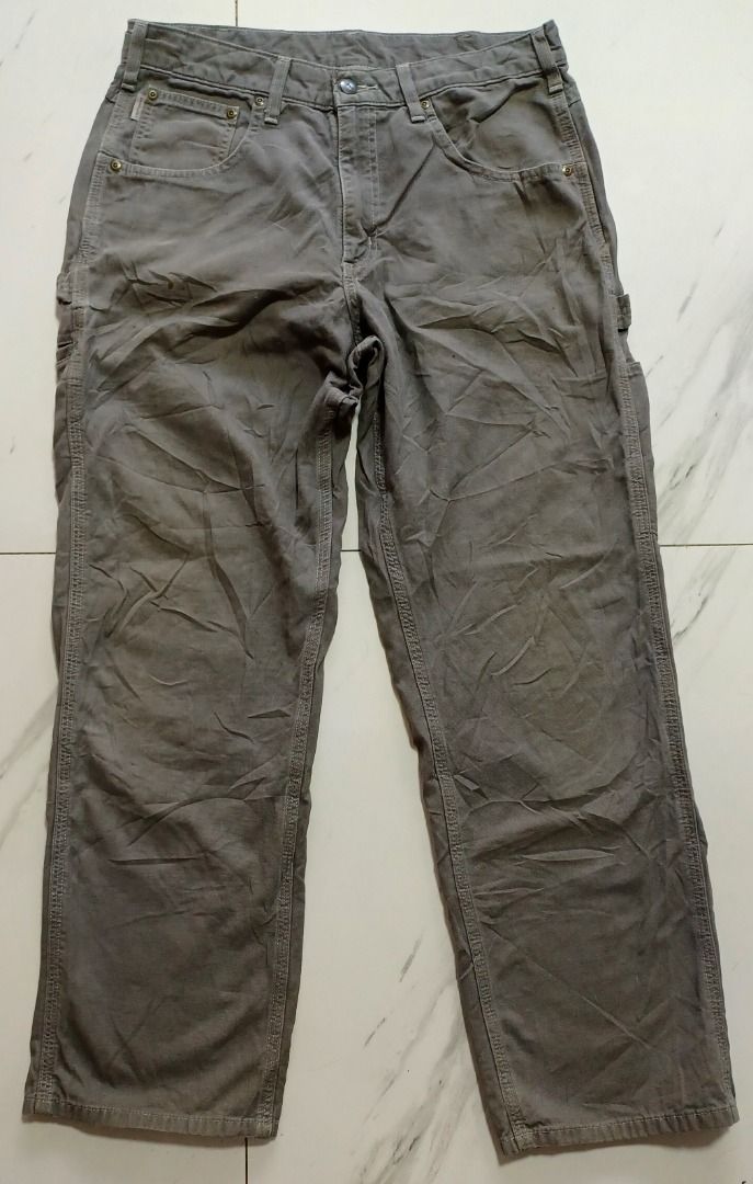 Carhartt Gray Carpenter Pants (Category: Jeans) located in Pasig City. Submitted by Magdythrift23 (Listing ID 1409076504, Image 2). Description: - Gray Carhartt carpenter pants - Carhartt logo on front pocket and back patch - Button and zipper closure - Made from durable fabric - Suitable for work or casual wear.