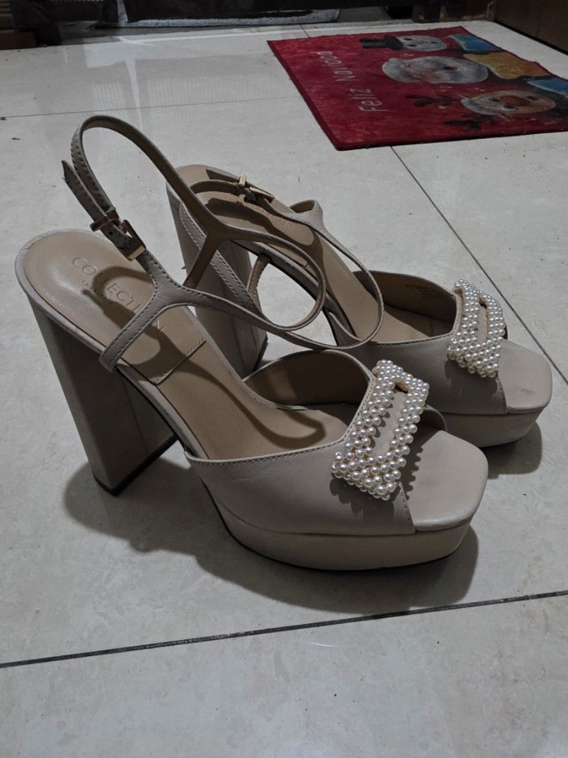 Charles & Keith Pearl Embellished Sandals (Category: Flats & Sandals) located in San Juan City. Submitted by mia.concep (Listing ID 1409243997, Image 2). Description: - Charles & Keith sandals - Beige color - Pearl embellished straps - Block heel - Ankle strap - Brand marked sole - Signs of wear on heels.