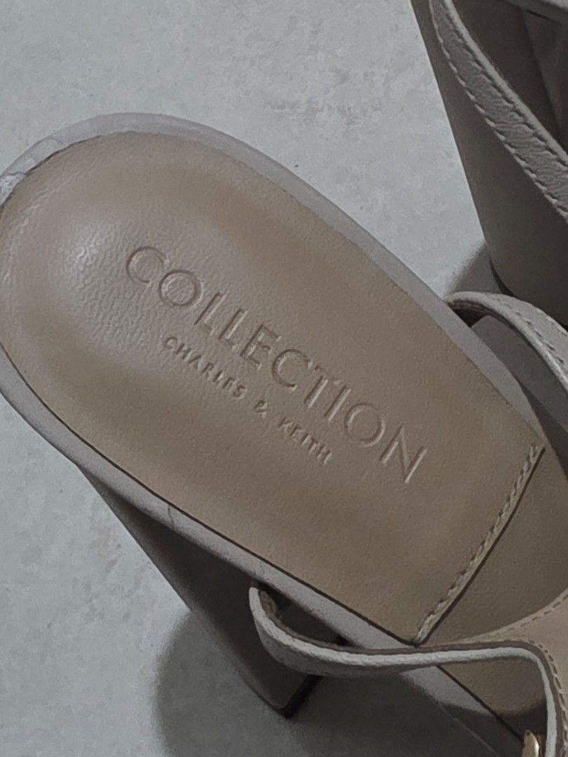Charles & Keith Pearl Embellished Sandals (Category: Flats & Sandals) located in San Juan City. Submitted by mia.concep (Listing ID 1409243997, Image 3). Description: - Charles & Keith sandals - Beige color - Pearl embellished straps - Block heel - Ankle strap - Brand marked sole - Signs of wear on heels.