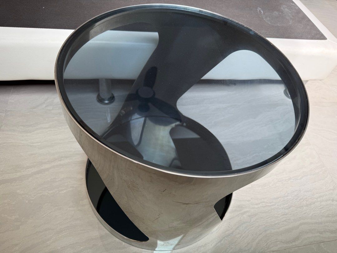 Coffee table (small) (Category: Tables & Sets) located in Singapore. Submitted by ycachong (Listing ID 1409190893, Image 1). Description: Coffee table (round) with steel chrome frame and grey tinted tempered glass top and bottom (48cm x 47cm), RRP S$399.