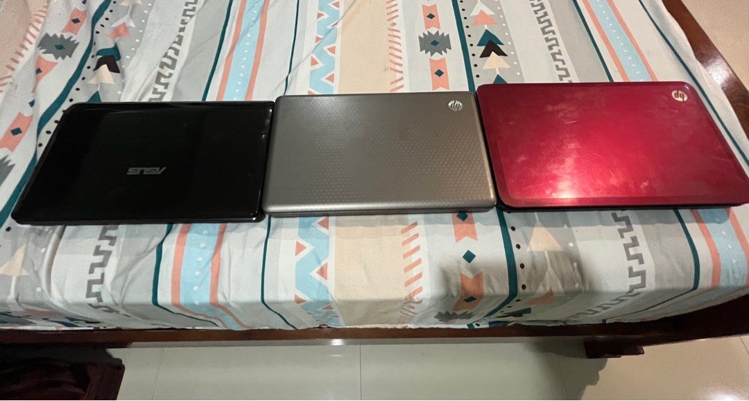[DEFECTIVE] Bundle of 3 Laptops (Asus and HP) (Category: Laptops & Notebooks) located in Quezon City. Submitted by rmel13 (Listing ID 1409232537, Image 2). Description: For Sale Only Bundle of 3 defective laptops 1 Asus Laptop 2 HP Laptops - Asus and Brown HP laptops lights up when plugged and fan spins but no display - Red HP laptop completely not turning on - comes with their original chargers though the HP laptops shares the same charger - SSD
