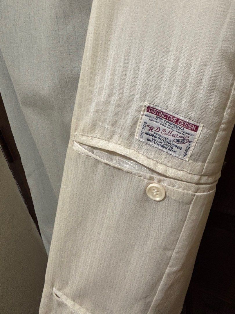 Distinctive Design Beige Skirt-Not used (Category: Skirts) located in Manila. Submitted by prelovedbymarbz (Listing ID 1409232947, Image 2). Description: - Distinctive Design beige skirt - Unique design with lighter-colored panel - Features a pocket with button detail - Zipper closure at the back - Subtle striped texture - Ideal for formal or semi-formal events.