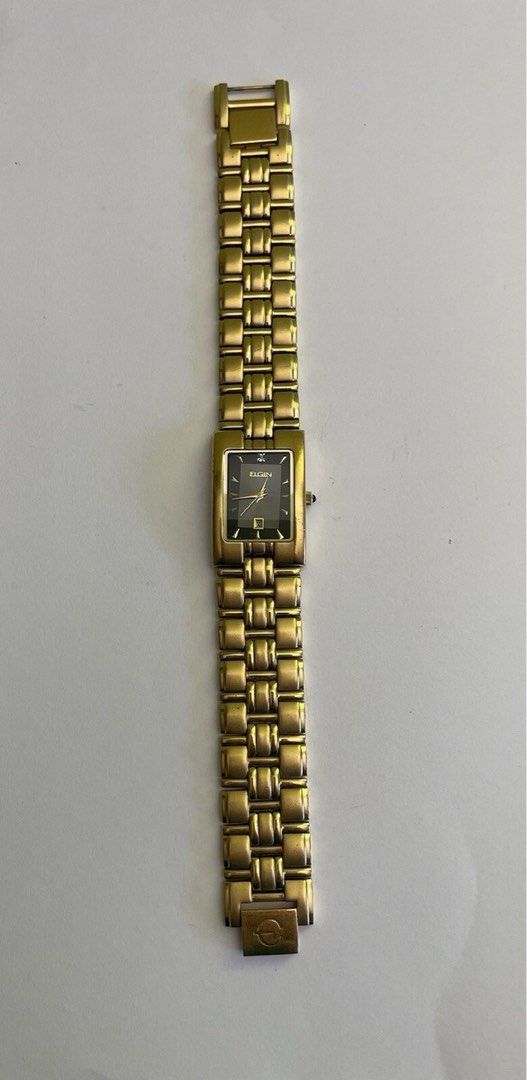 Elgin Diamond Quartz Watch (Category: Women's Watches) located in Quezon City. Submitted by ysabellashoppe (Listing ID 1409086977, Image 1). Description: - Elgin watch - Rectangular black dial - Gold-toned bracelet and case - Diamond accent - Date display - Quartz movement.