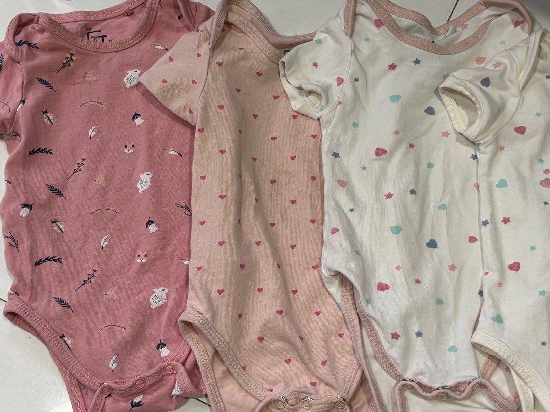 FT Baby Bodysuits - Set of 4 (Category: Babies & Kids Fashion) located in Quezon City. Submitted by things.matter (Listing ID 1409142490, Image 2). Description: - Set of four baby bodysuits - Designs: - Pink with bird and leaf pattern - Pink with heart patterns - White with star and heart patterns - White with "hug me" text - Features: - Short sleeves - Snap closures at the bottom -super soft quality yung cotton niya .