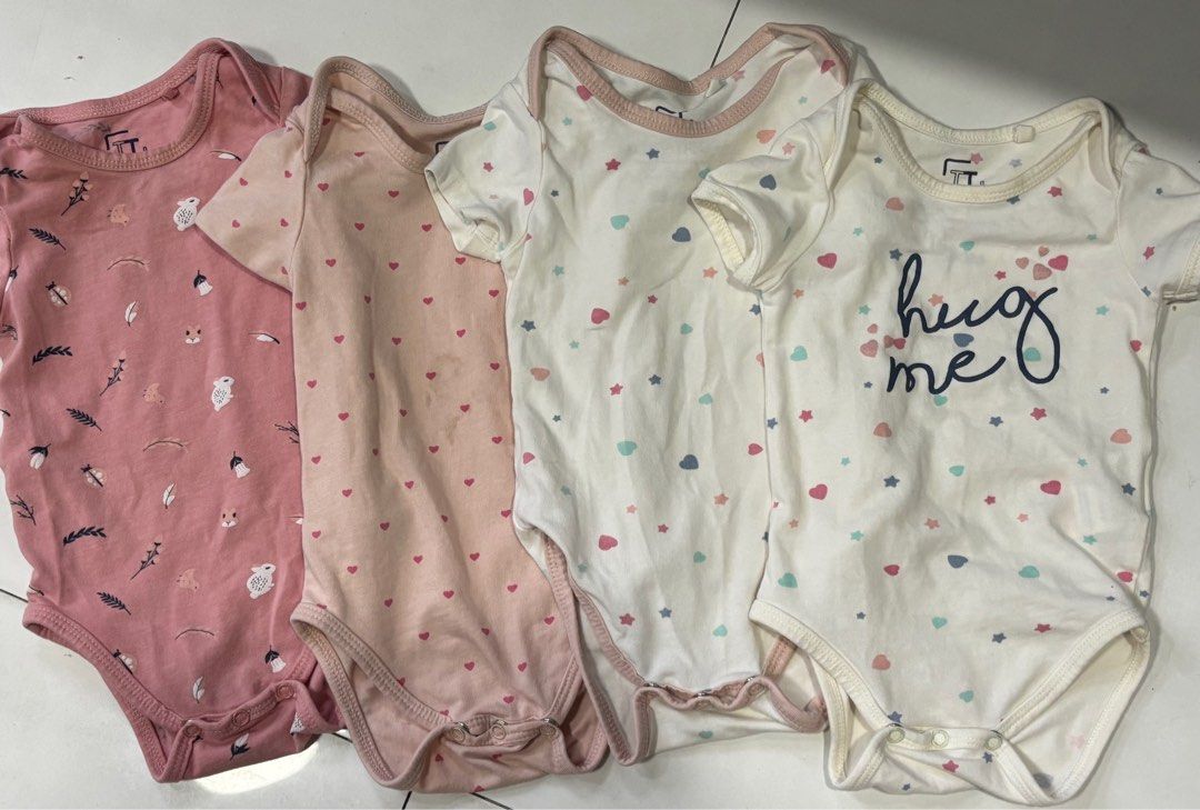 FT Baby Bodysuits - Set of 4 (Category: Babies & Kids Fashion) located in Quezon City. Submitted by things.matter (Listing ID 1409142490, Image 3). Description: - Set of four baby bodysuits - Designs: - Pink with bird and leaf pattern - Pink with heart patterns - White with star and heart patterns - White with "hug me" text - Features: - Short sleeves - Snap closures at the bottom -super soft quality yung cotton niya .