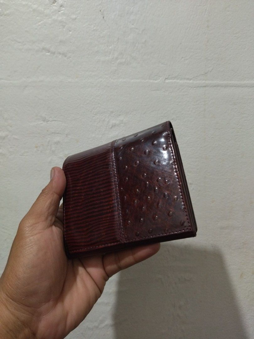 Givenchy Leather Bifold Wallet (Category: Luxury Bags & Wallets) located in Bulacan. Submitted by THA_D_THRIFT (Listing ID 1409108158, Image 3). Description: - Givenchy bifold wallet - Brown leather exterior - Gold-tone accent - Deep burgundy interior - Multiple card slots - Coin compartment FRESH FROM JAPAN SOURCE EXCELLENT CONDITION SIGN OF USAGE 2499 + SF.