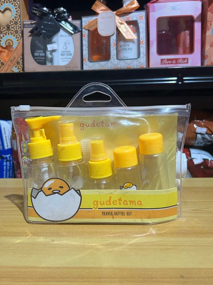 Gudetama Travel Bottle Set (Category: Water Bottles & Tumblers) located in Tarlac. Submitted by dgdgc (Listing ID 1409073353, Image 1). Description: - Gudetama travel bottle set - Includes multiple bottles with yellow caps - Comes with a clear carrying case - Features the Gudetama character - Ideal for travel or everyday use - Convenient and cute for organizing liquids.