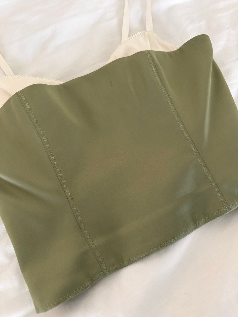 hypnotize satin bustier - sage - aritzia (Category: Sleeveless) located in Mandaluyong City. Submitted by outofstoragewtf (Listing ID 1409124500, Image 2). Description: Retails Php 8,500 or 140 USD This is a bustier top with adjustable straps and princess seams for shaping. It’s crafted from a soft-sheen satin with a smooth feel and stretch for all-day comfort. This fabric is made with 65% recycled polyester.