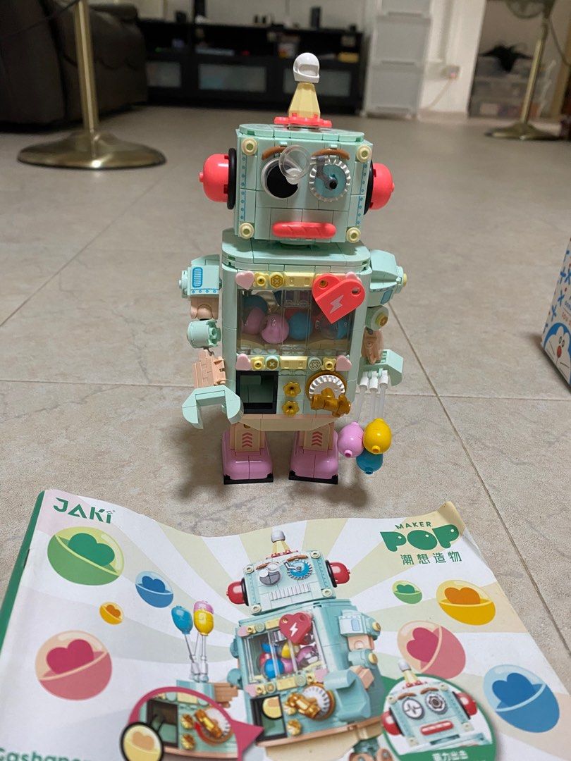 JAKI Maker Pop Gashapon Machine Robot Building Block Set (Category: Lego & Building Sets) located in Singapore. Submitted by littlegoesalongway (Listing ID 1409079019, Image 2). Description: Adorable JAKI Maker Pop Gashapon Machine Robot building block set is almost new and assembled! It features a unique design with a gashapon machine theme. Includes the instructions. Perfect for collectors or anyone who loves building blocks! We can dissemble f