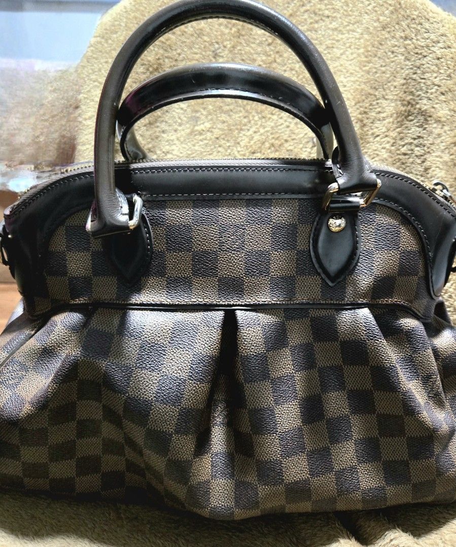 Louis Vuitton Damier Ebene Trevi bag (Category: Luxury Bags & Wallets) located in Quezon City. Submitted by bk2025 (Listing ID 1409244793, Image 1). Description: - Authentic LV Damier Ebene Trevi bag - Two top handles - Structured design - Pleated detail on front - Gold-toned hardware - Suitable for everyday use.