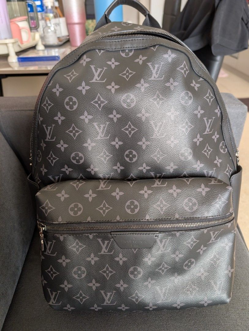 Louis Vuitton Monogram Eclipse Backpack (Category: Bags & Wallets) located in Singapore. Submitted by lawrencelimwb@gmail.com (Listing ID 1409190157, Image 1). Description: - Authentic Louis Vuitton Monogram Eclipse Backpack - Stylish design - Spacious main compartment - Convenient front pocket - Interior slip pocket for organization - Well-maintained zippers - Suitable for everyday use and travel.