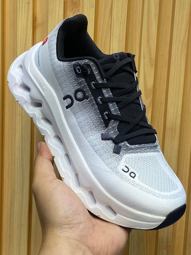 On Cloudnova & Cloud 5 Shoes (Category: Sneakers) located in Manila. Submitted by astiga (Listing ID 1409144640, Image 2). Description: - Pair 1: On Cloudnova in white and gray. Features a distinctive sole design. - Pair 2: Black On shoes with an all-black design. - Both pairs are in their original boxes. - Both pairs feature the On logo..