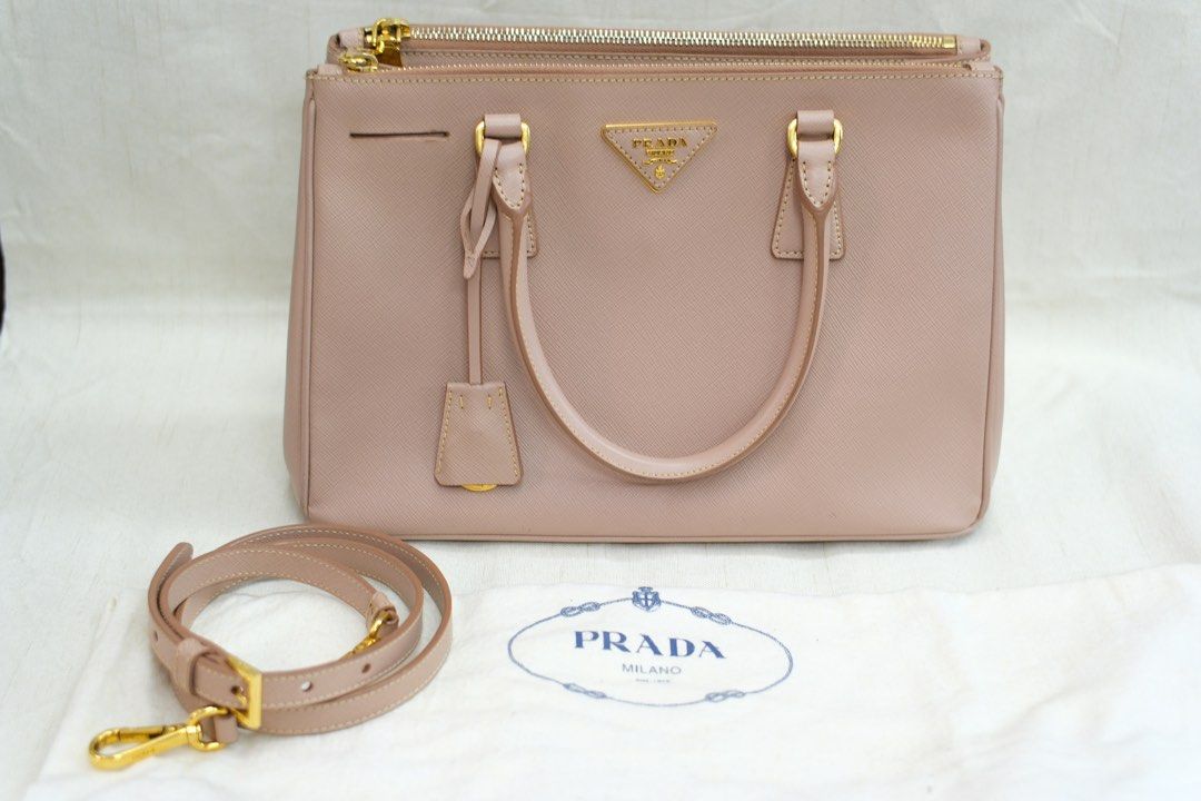 PRADA DOUBLE ZIP (Category: Luxury Bags & Wallets) located in Quezon City. Submitted by mcikgm (Listing ID 1409222868, Image 1). Description: - PRADA Double Zip Galleria Saffiano Leather bag - With Authenticity Cert - Blush pink color - Crossbody style with detachable strap - Features gold hardware.